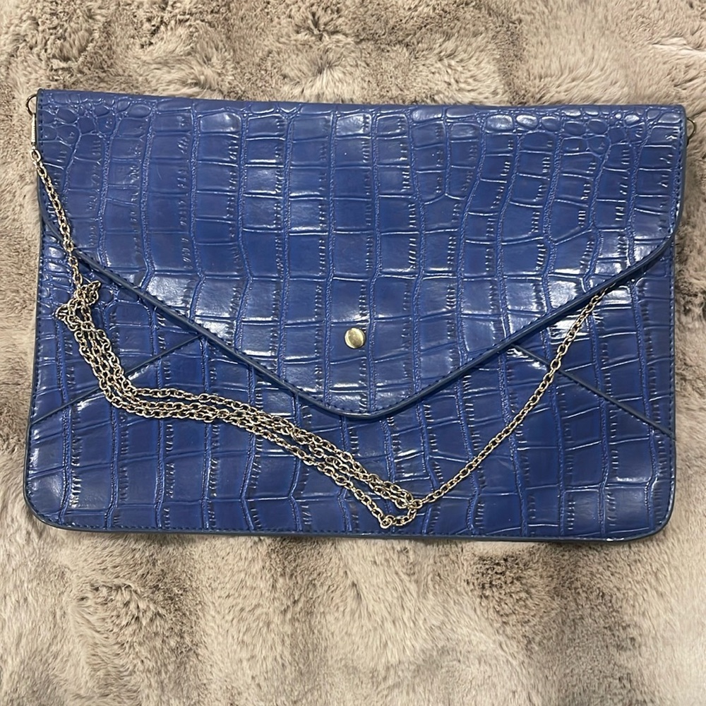 Very fun letter size (IPad size) handbag. Soft and cute. Gold chain strap.